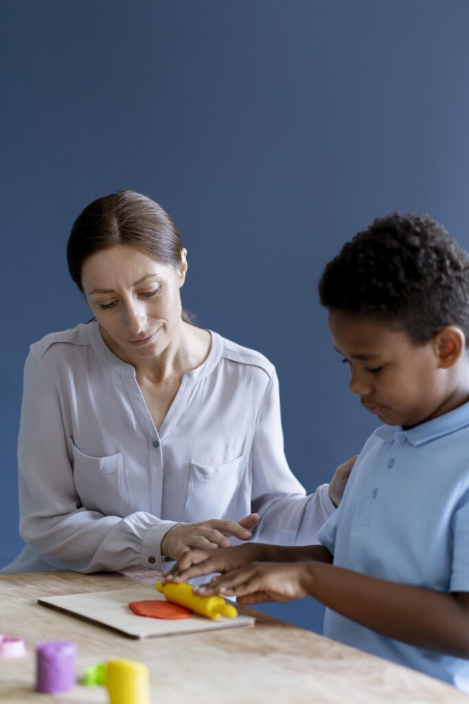 kid doing occupational therapy session with psychologist